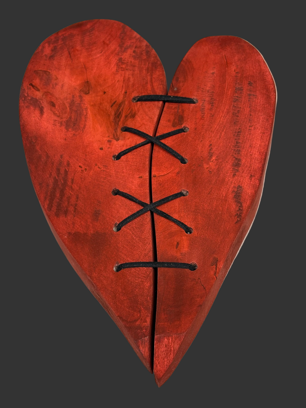 Repaired sculpted wooden heart – handcrafted wall decoration – symbolic laced heart